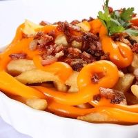 imagem do produto: Porção de Batata Frita c/ Chadder e Bacon 